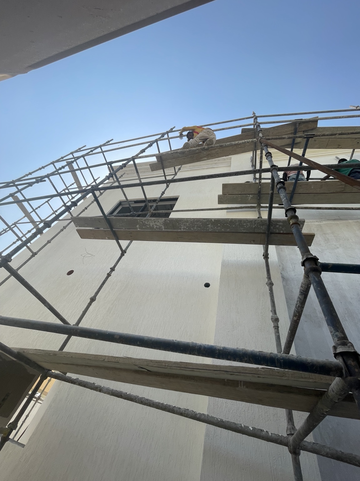 Construction worker on scaffolding at a Fast Track project